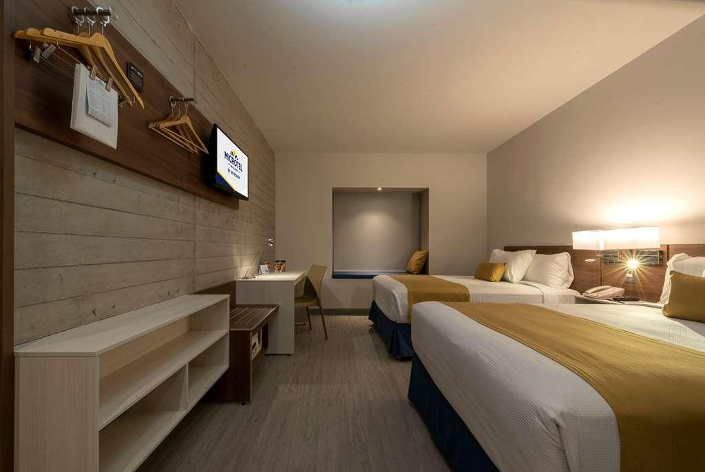マイクロテル イン&スイーツ バイ ウインダム イラプアト 部屋 写真